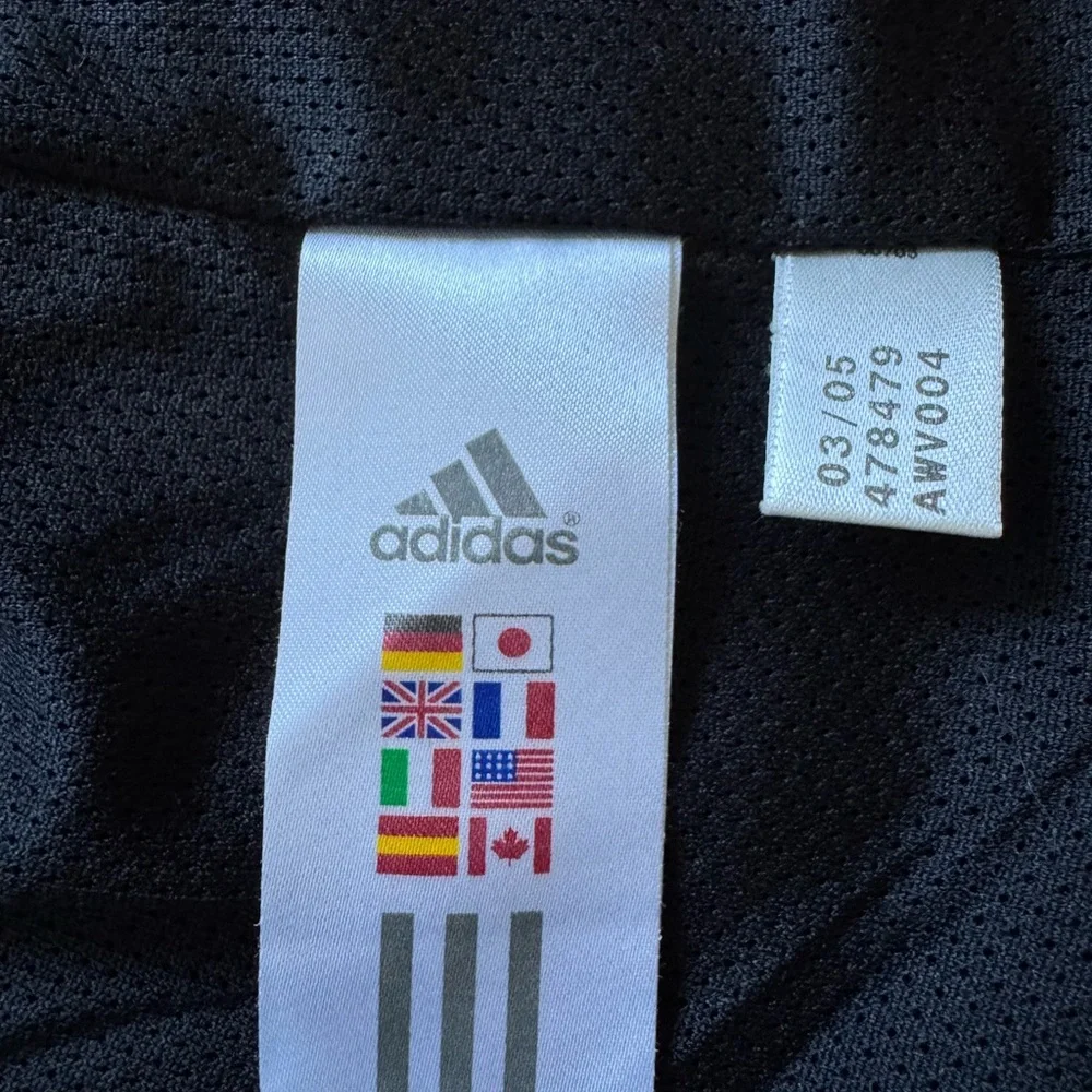 Vintage Adidas black, orange & white windbreaker jacket.  Men’s size small
